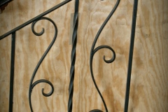 S104 Sample Custom hand forged vine S scroll with a twisted metal baluster interior stair rail