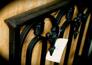 S122 Sample wrought iron rail with hand forged metal Oval with decorative finials and top cap on hand rail