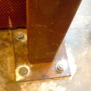 Structural steel-1/2" bottom plate with engineered below grade beam tied in to above ground structural)